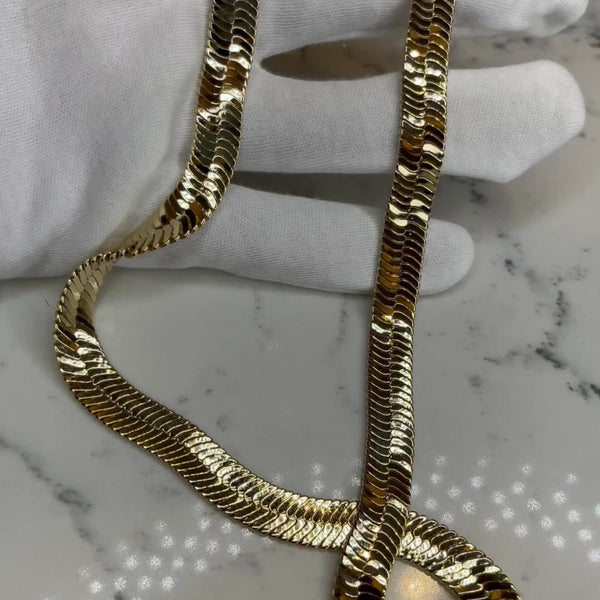 Super on trend and definitely a statement piece! Wear this beauty alone or stack it with a few dainty necklaces to elevate your look even more!  14 karat gold plated, jumbo, herringbone necklace, 18" in length.  Expect to get up to 1 year worth of tarnish proof, water resistant wear from our jewelry with proper care. Hypoallergenic.