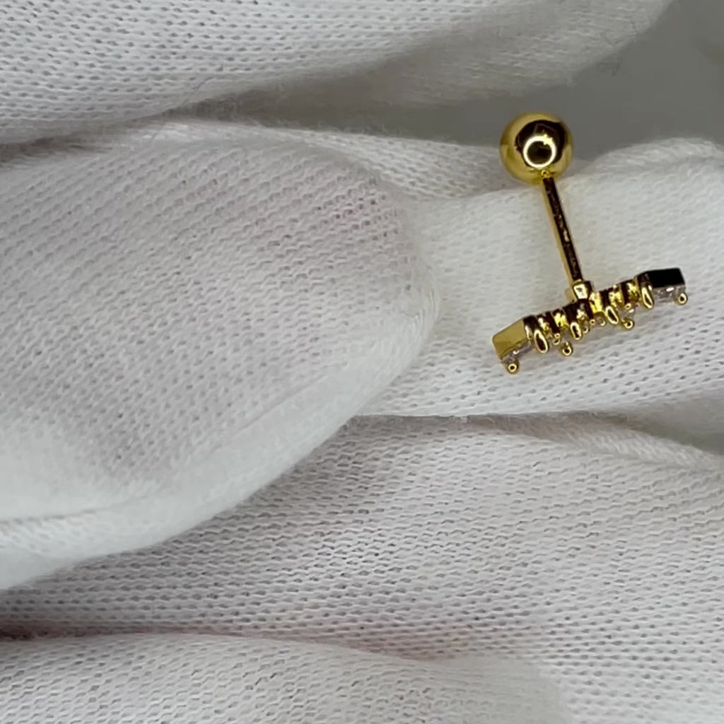 Never let your crown tilt in this luxe, quality nose ring that can also be worn as an earring!   Sold in a quantity of 1: 18k gold plated, 6mm barbell post, with baguette and round A+++ CZ stones, placed in a semi-curved bar resembling a crown design with a screw ball back for added security while in the nose or ear.  Expect to get up to 1 year worth of tarnish proof, water resistant wear from our jewelry with proper care. Hypoallergenic.