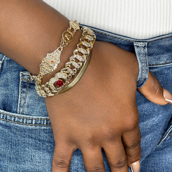 The perfect, dainty, vintage style bracelet to spice up any outfit for every occasion! Mix and match this beauty with any of our other Zoe Mar arm candy for a complete look...  18k gold filled, 18.5" in length, 13MM in width with a red, brilliant, A+++ CZ crystal stone in the center of the bracelet. Lobster Claw closure.  Expect to get up to 1 year worth of tarnish proof, water resistant wear from our jewelry with proper care. Hypoallergenic.