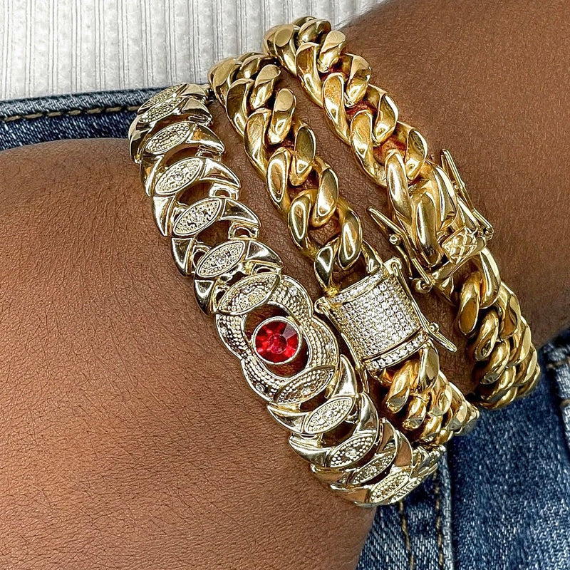 Vintage Egyptian style bracelet to make you feel like the queen you are! Mix and match this beauty with any of our other Zoe Mar arm candy for a complete look...  Seen styled here with our Vintage Coco Bracelet and our Classic Herringbone Bracelet  18k gold filled, 8.5" in length, 13.4MM in width with a red, brilliant, A+++ CZ crystal stone in the center of the bracelet and tiny A+++ CZ crystal stones throughout the bracelet. Fold over clasp closure.